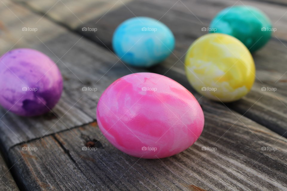 Colorful easter eggs on wood