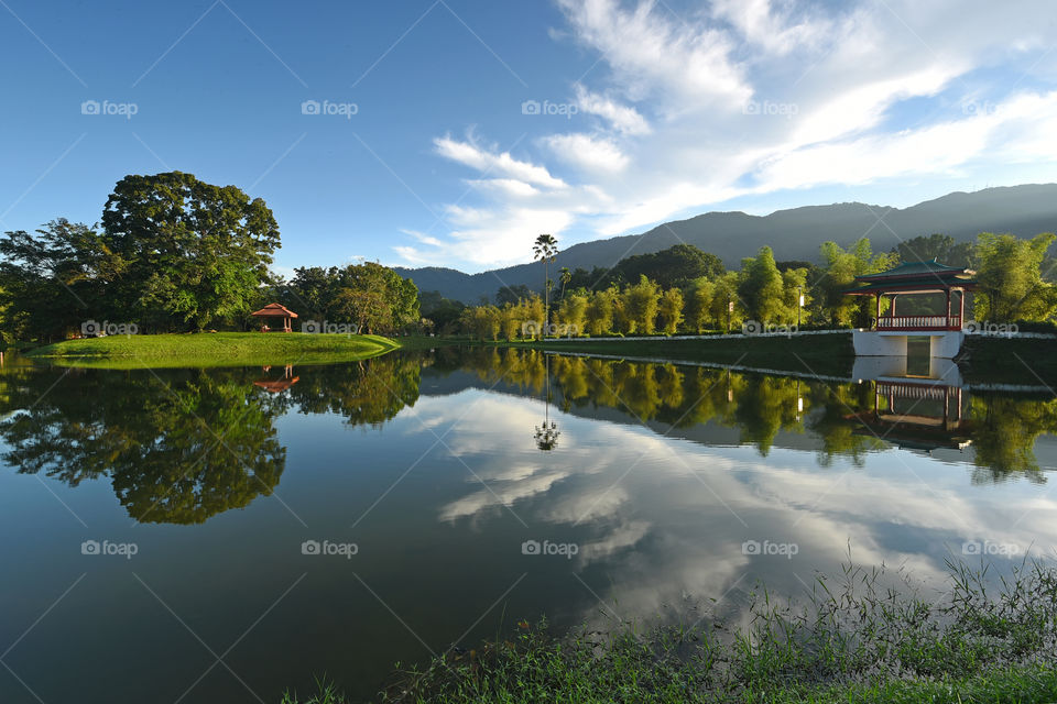 Lake garden reflections with blue sky background
