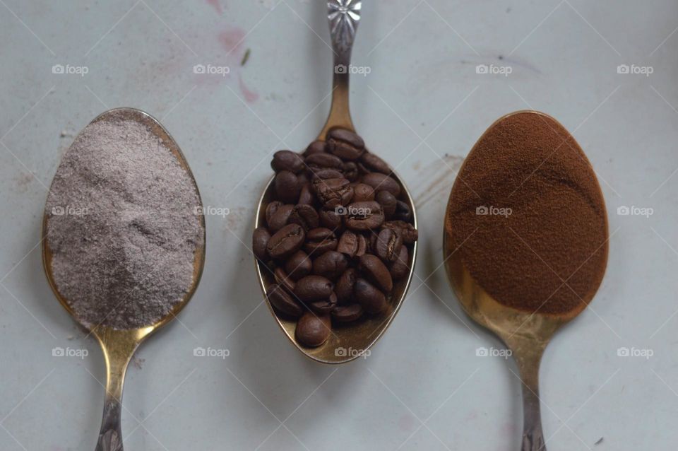 3 in 1 coffe3, coffee beans and instant coffee  on the spoons