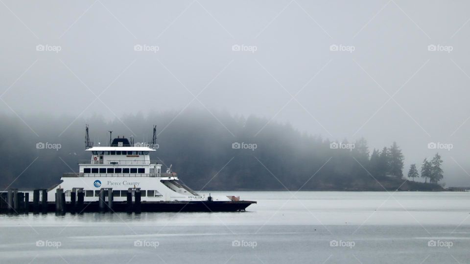 The Steilacoom ferry sits at port waiting for passengers to board on a foggy Pacific Northwest day