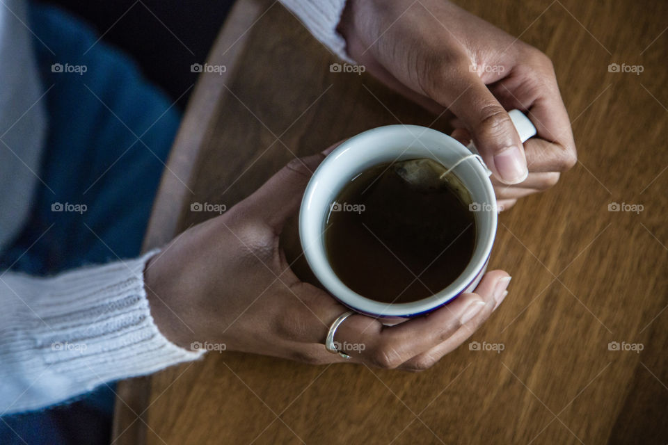 Close-up of person holding a tea cup