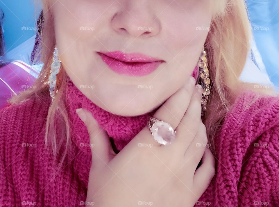 Wearing a pink topaz ring and Swarovski earrings