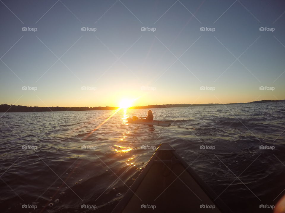 Kayaking into the sunset! Long Lake Michigan 