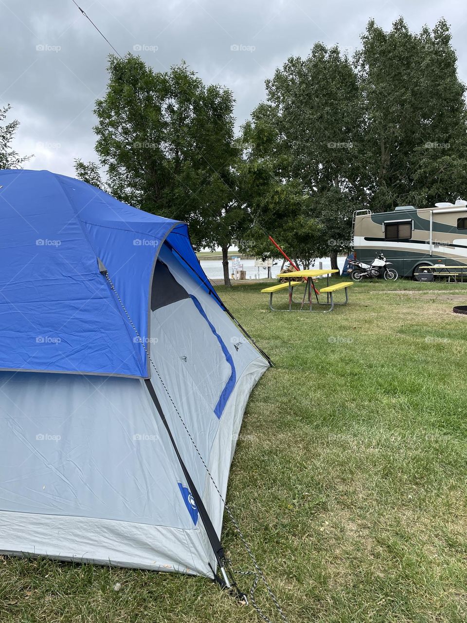 A cloudy day at Rattlesnake Dam lake, by Medicine Hat, Alberta, Canada, doesn’t stop me from camping in my blue topped tent