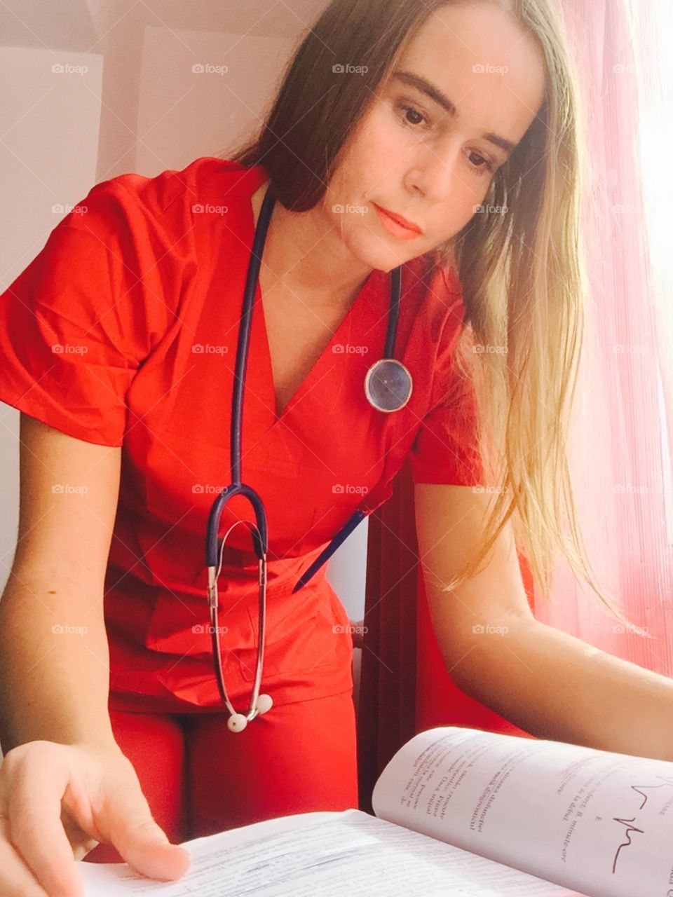 Medical doctor completing the consultation sheet