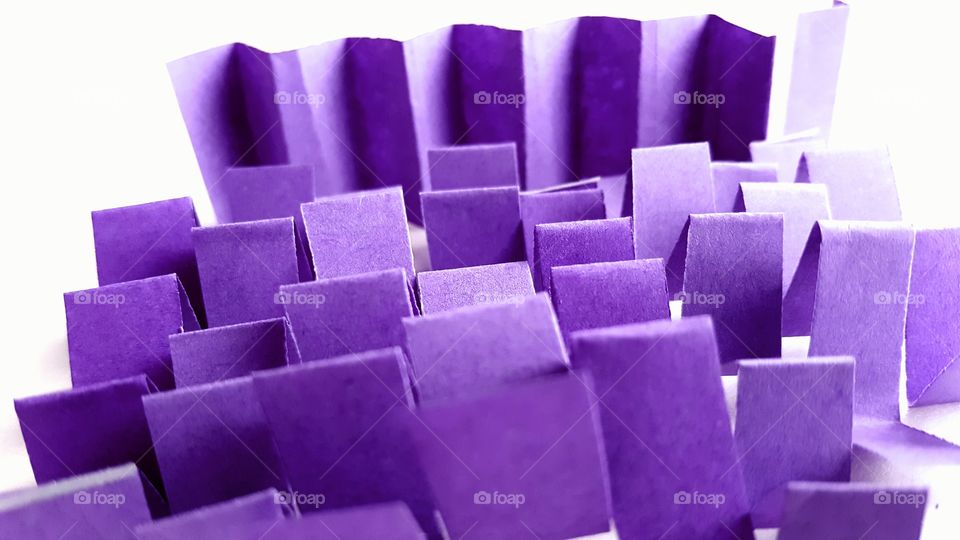 Close-up of purple objects against white background