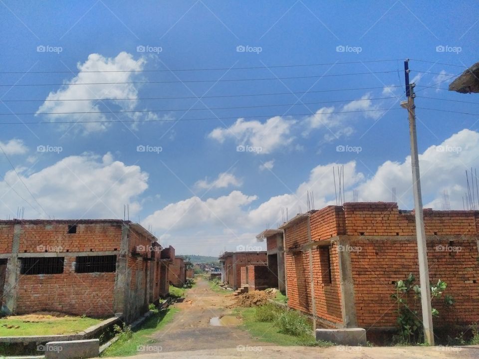 The picture of the new building is being displayed on this picture, with which the blue sky looks beautiful with the change
