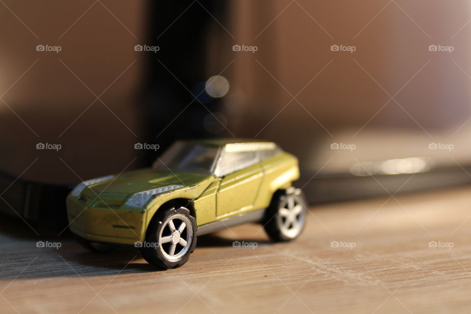 low light plastic toy car close-up
