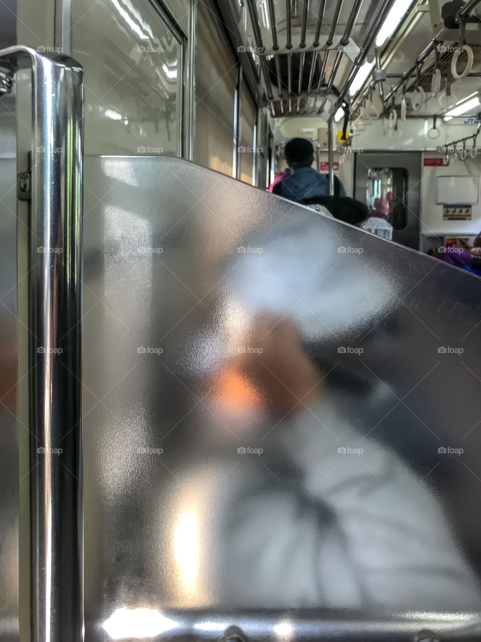 Jakarta, Indonesia; this is the rare view of city train in the city, usually there is no rush hours, every hours is a rush, always crowded but during pandemic, this kind of view is common, one passenger sitting on a corner