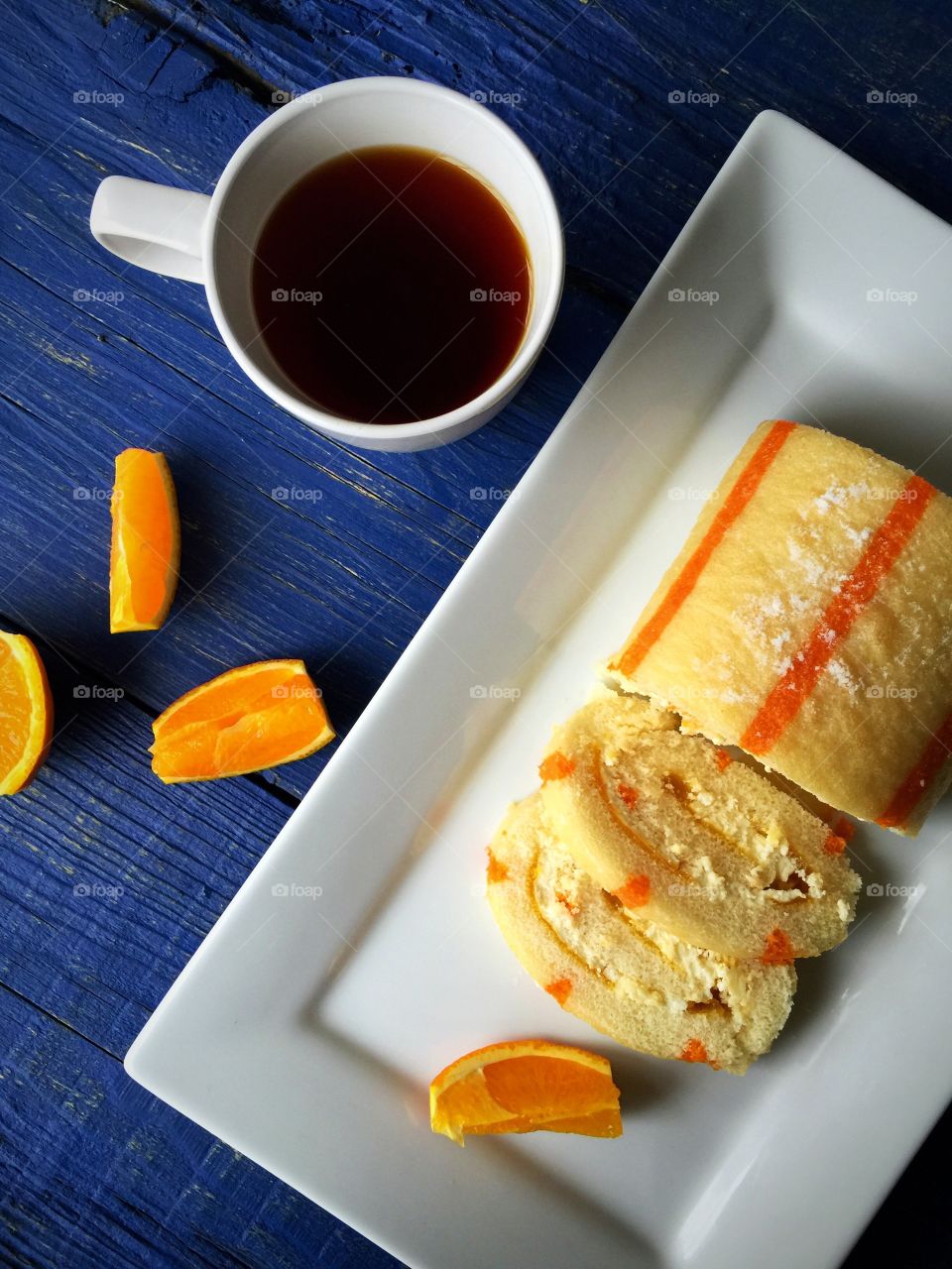 Coffee with cake and orange fruit