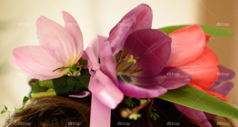 Colorful Tulip Flower crown on hair with ribbon closeup full frame hair accessory celebration photography 