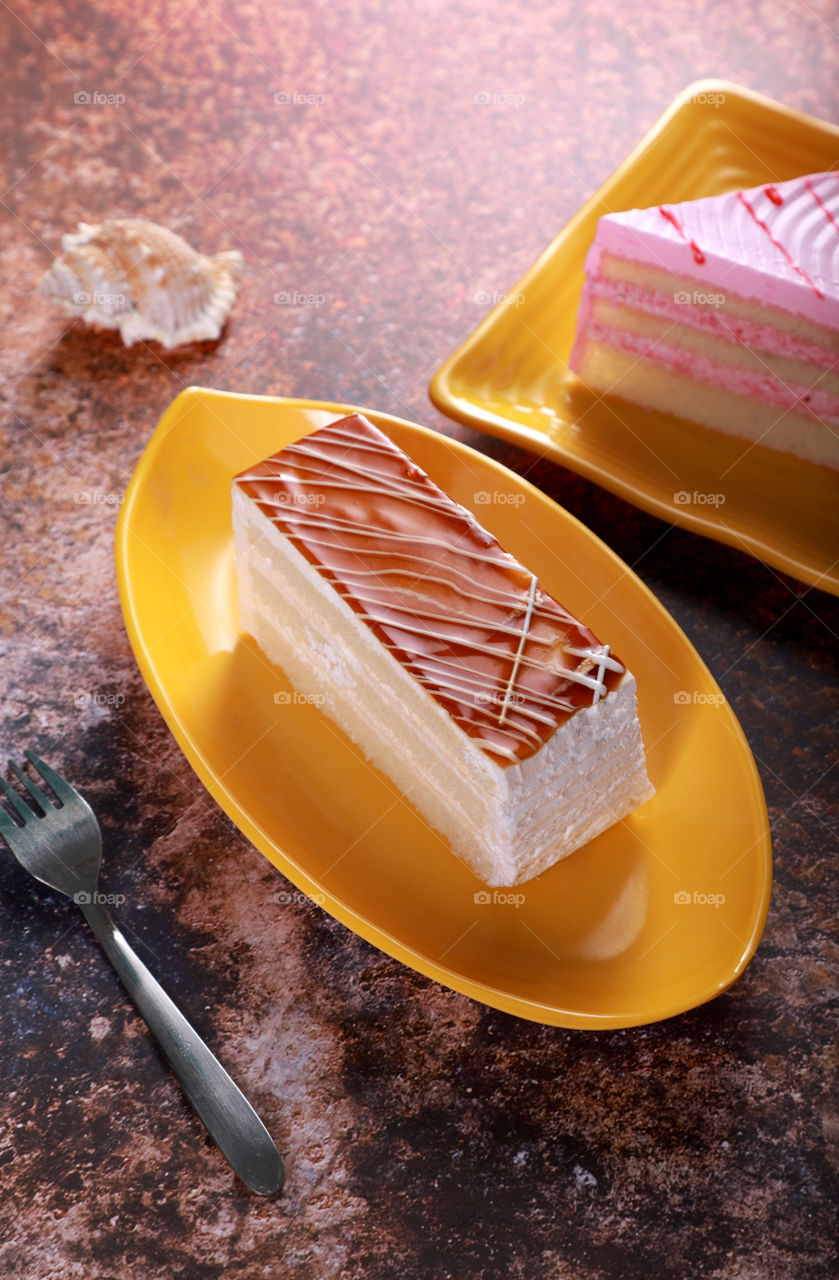 Cheese / Caramel Pastry cake on old rustic background