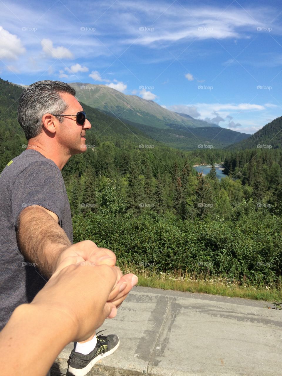 Close-up of a mature man holding human hand