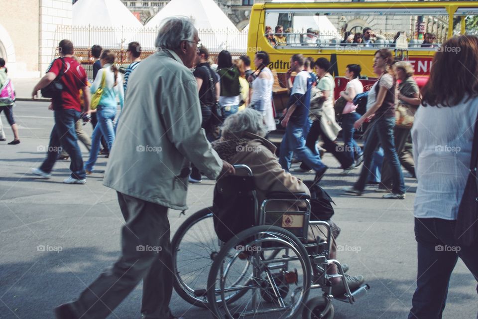 Elder couple at wheelchair 