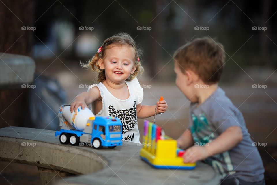 Girl playing with truck 