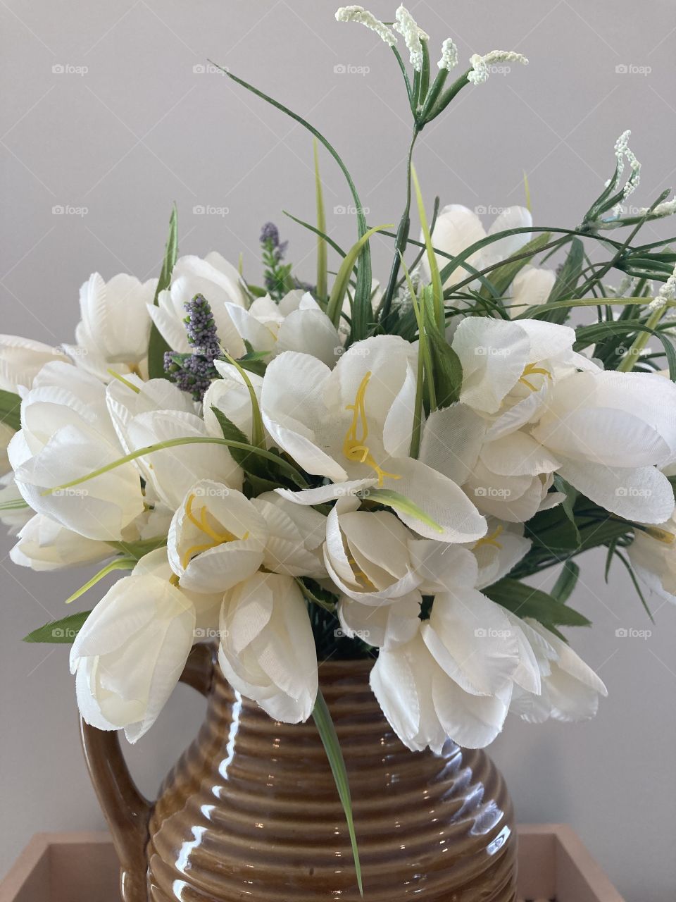 Beautiful White Flowers in a Glass Brown Vase