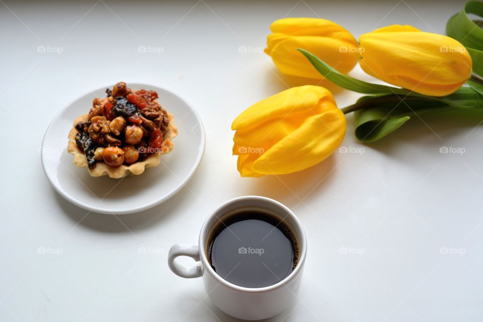 coffee mug and cake on a white background