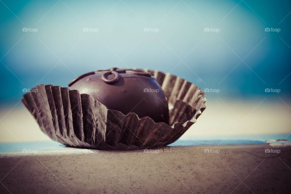 Chocolate truffle with Beach background