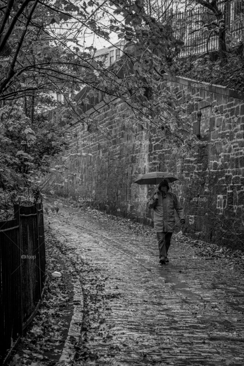 Walking down a rainy street in Glasgow