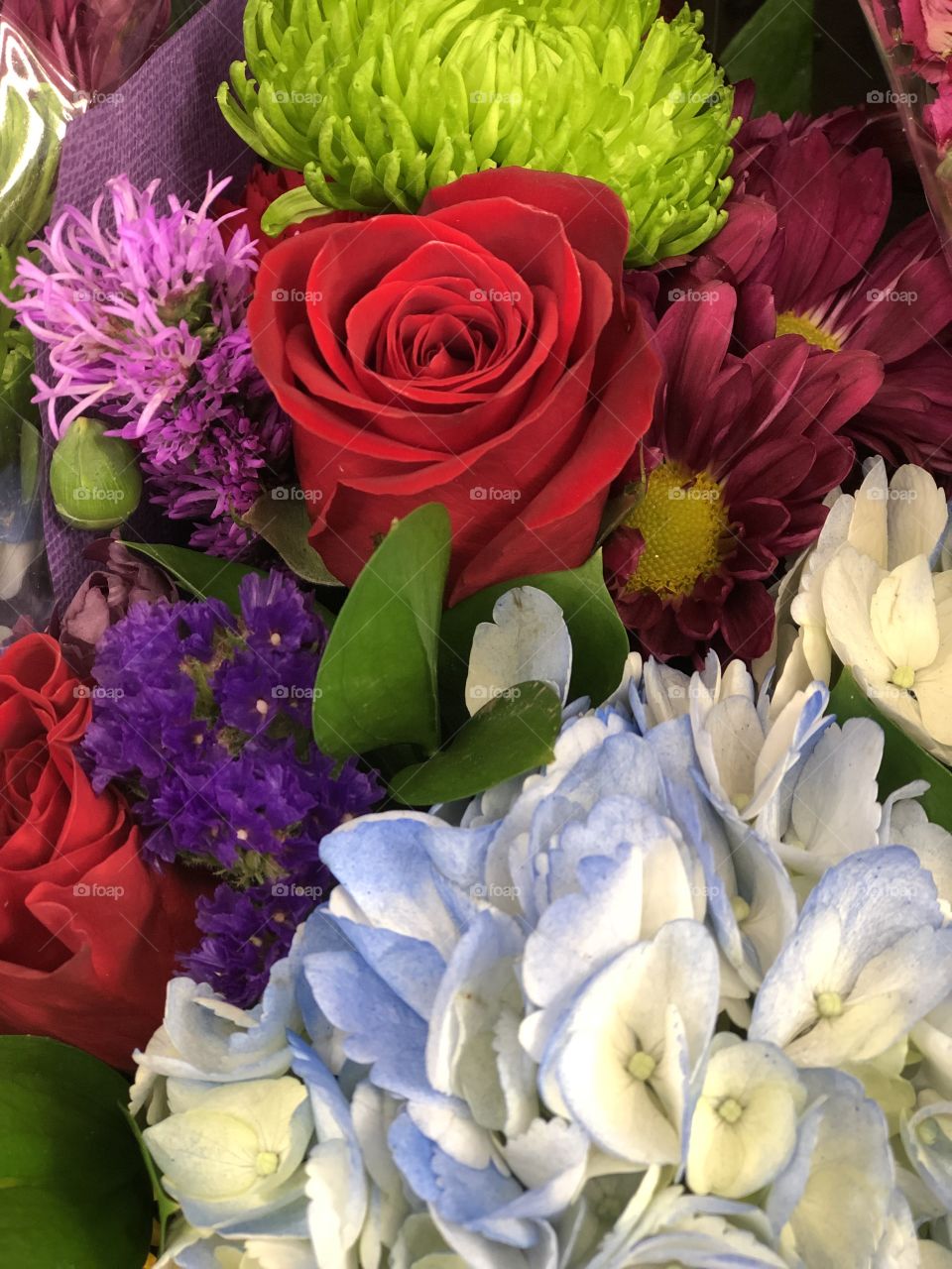 Floral arrangement with red rose