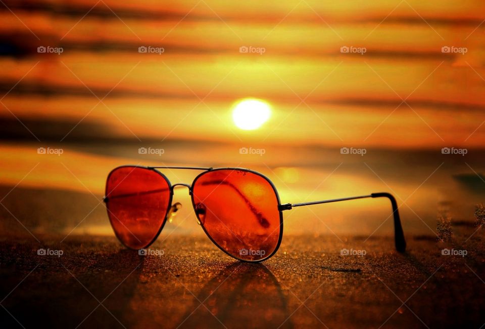 In this photo you can see a cooling glass with sunset, evening view