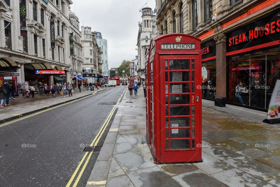 Red telephone booth near Piccadilly Circus in London.