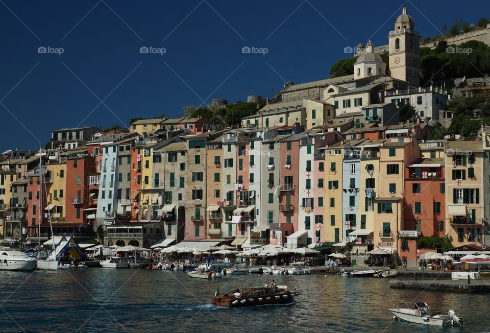 Houses, yachts and boats in harbor in Portofino in Liguria in Italy,