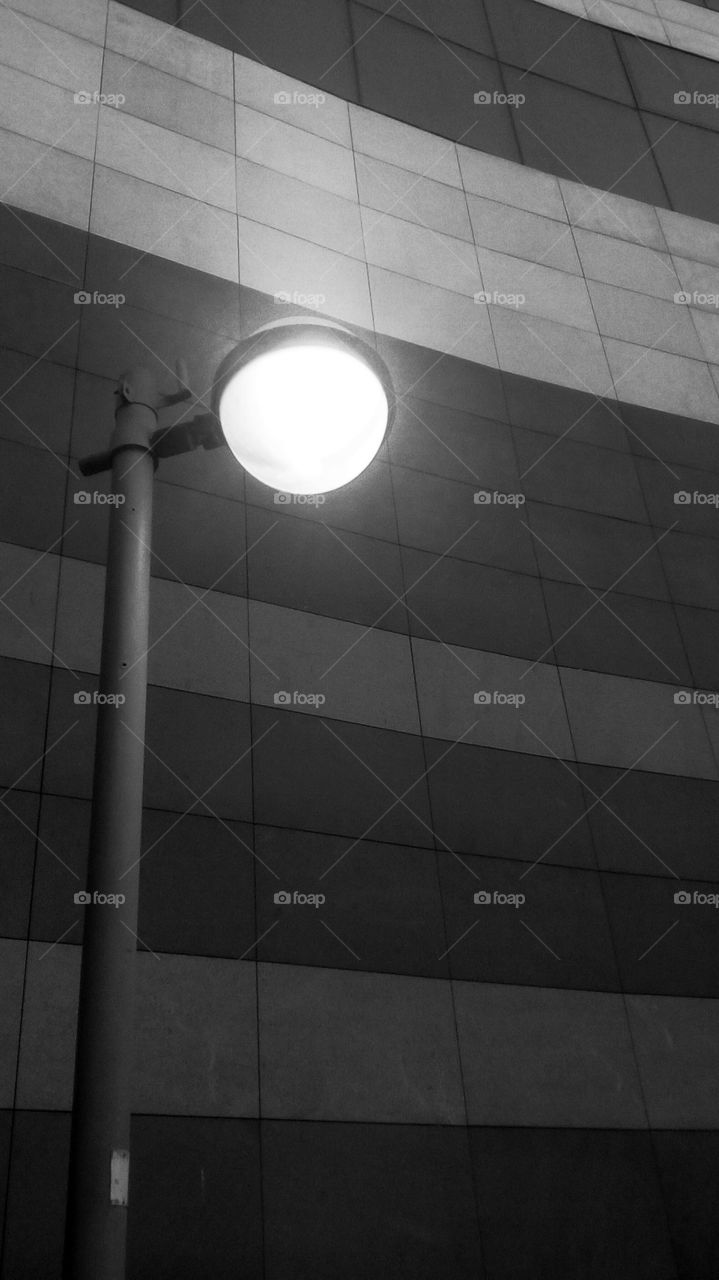 Light in the night#
Tallest street lamp near modern building
wall in night