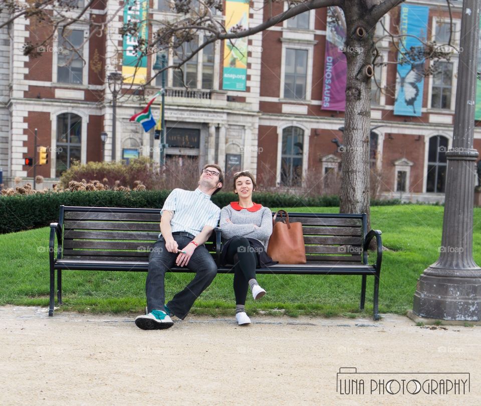 Lovers dreaming on a bench together 