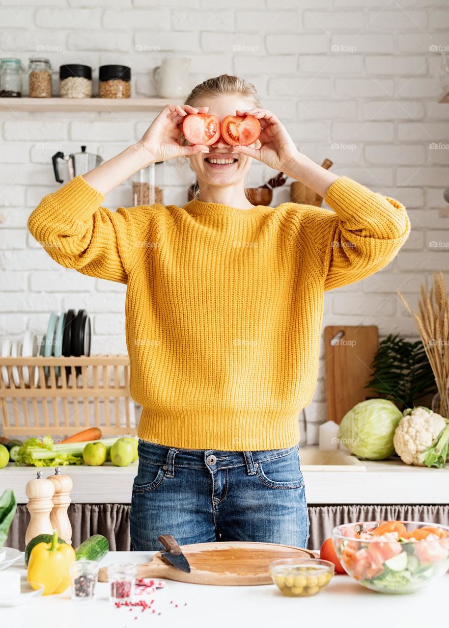 Woman with tomatoes at the Kitchen