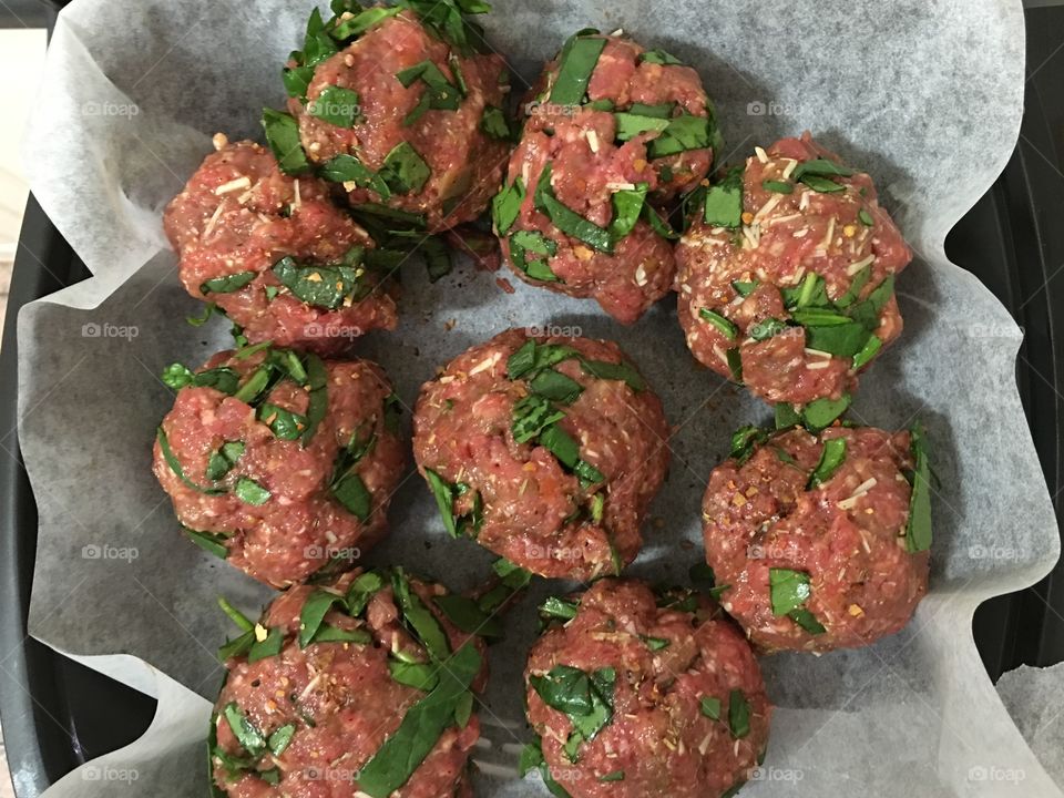 Food prepping beef meatballs closeup raw uncooked