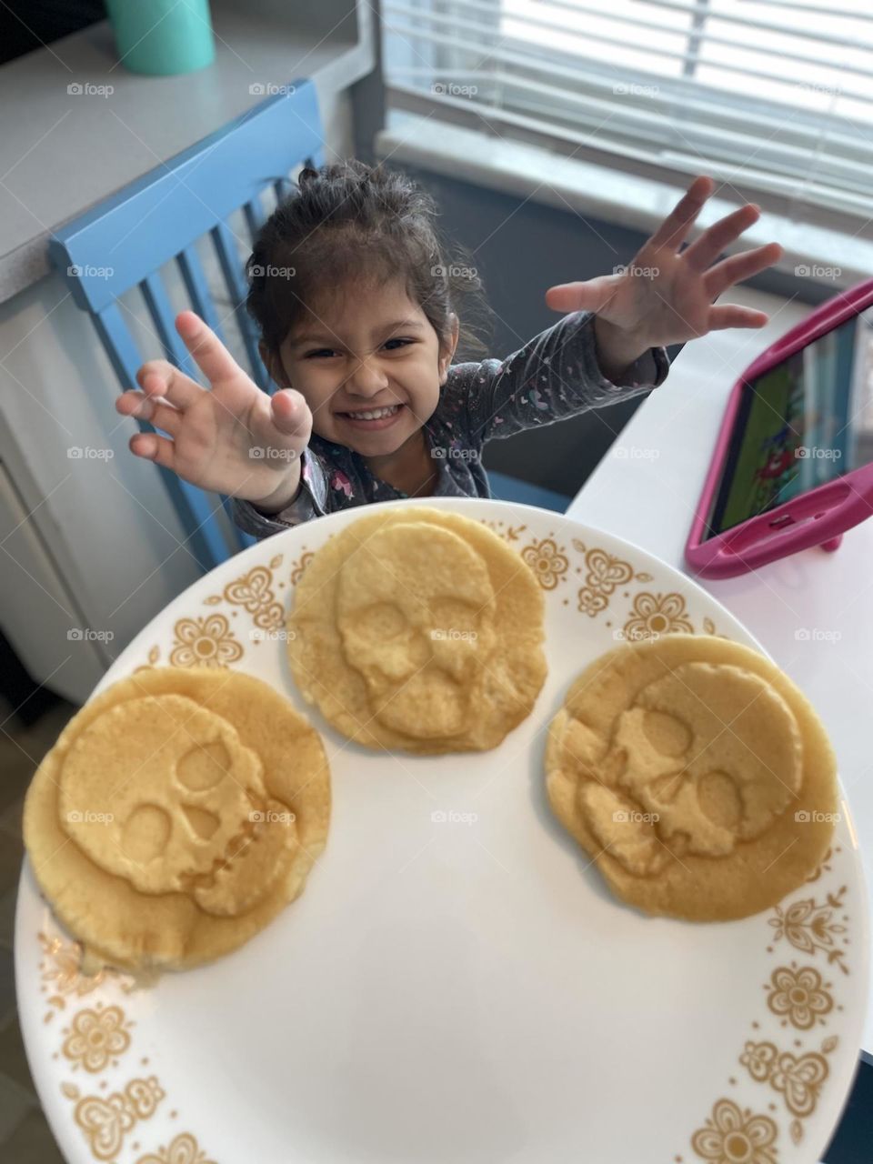 Little girl excited for skull waffles, toddler girl wants skull waffles for breakfast, eating breakfast with toddlers, skull waffle maker, making waffles for your family, making homemade breakfast 