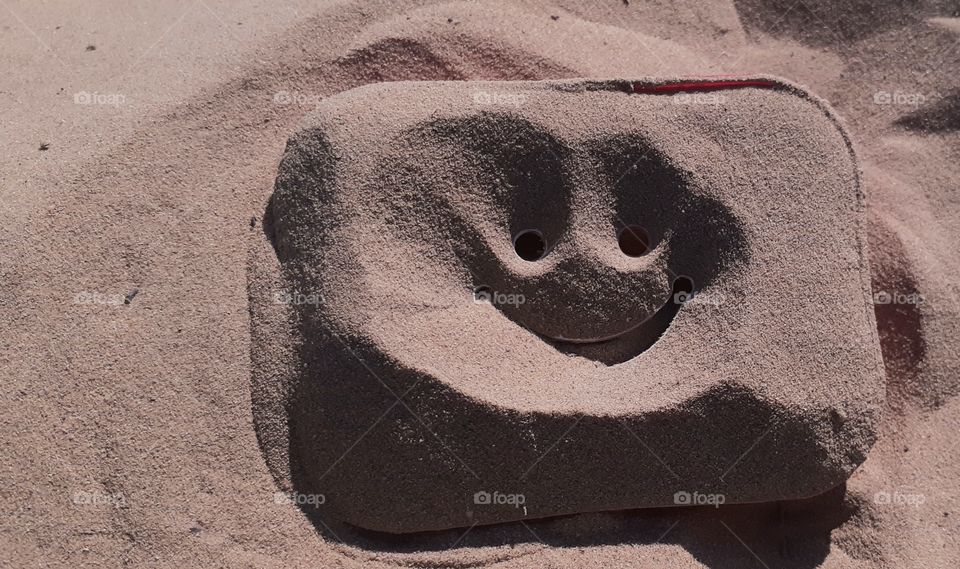 A funny soapbox in sand