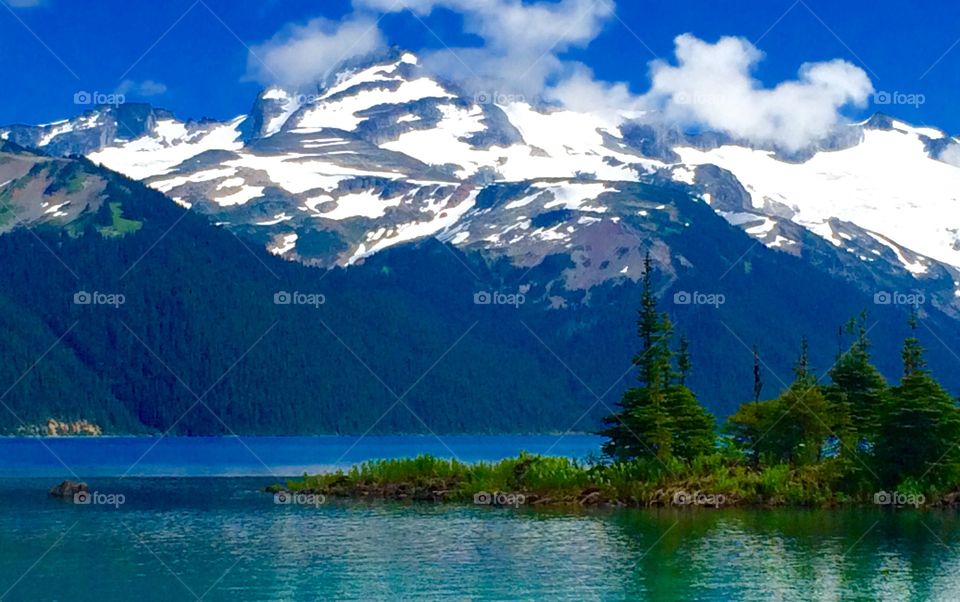 A gorgeous turquoise coloured glacial lake surrounded by tall peaks, rocky shores, subalpine meadows and evergreen forests. Located in Garibaldi Provincial Park
