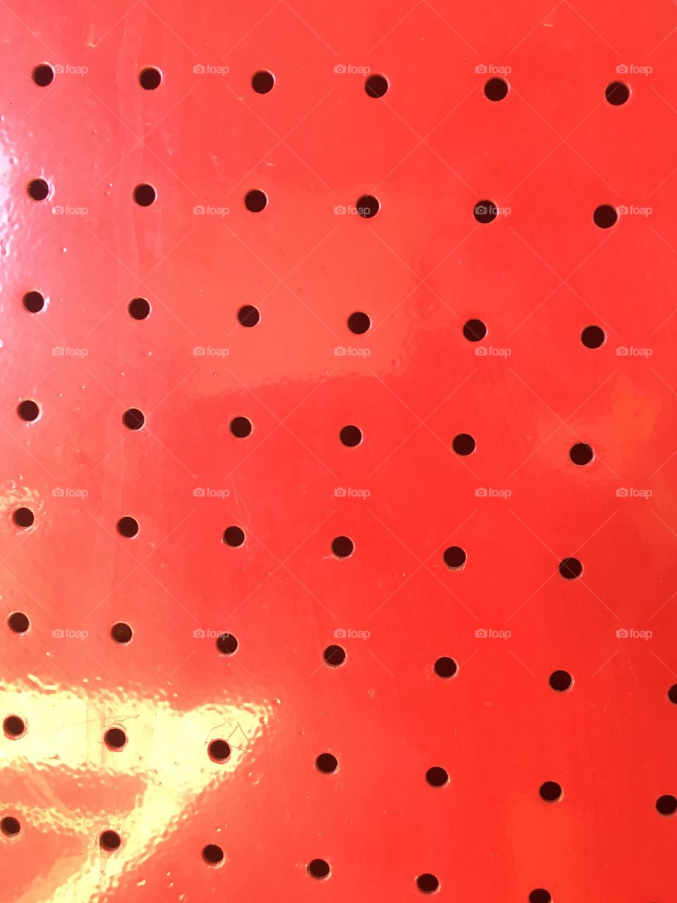 Red holed panel patterns
