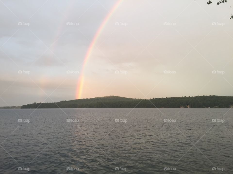 gorgeous double rainbow over lake winnipesaukee