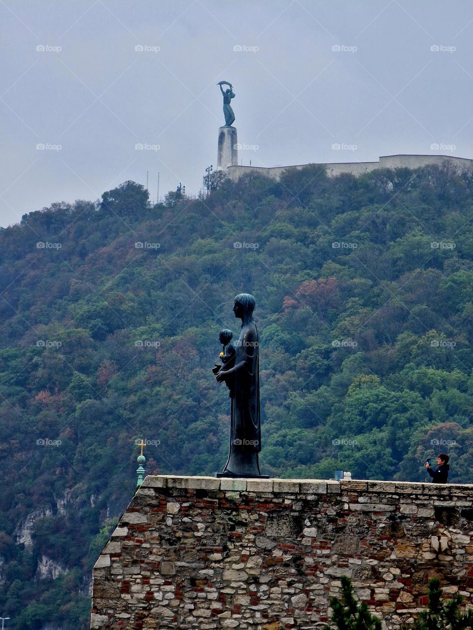 taking a picture at the statue