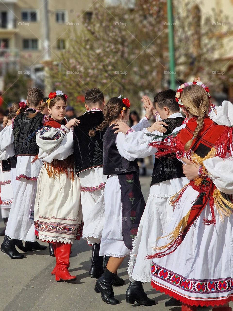 dancing in traditional Romanian costumes