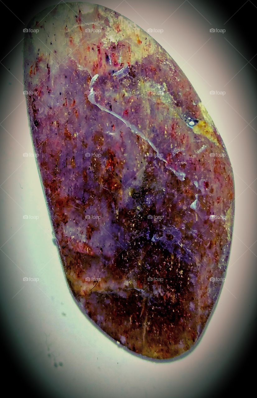 Black fire opal showing brilliant play of color