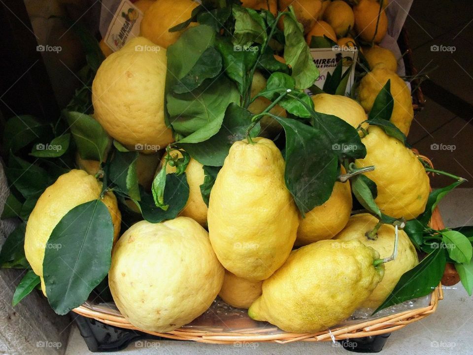 Large display of Lake Garda lemons on display in Limone sul Garda, resembling a still life painting.