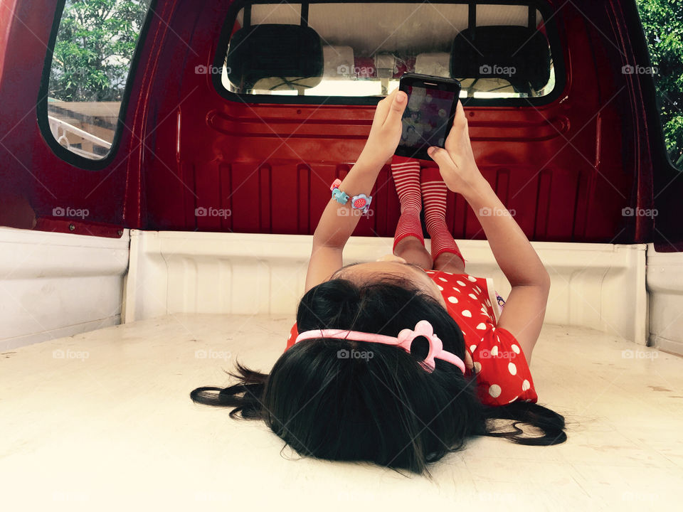 A little girl using smartphone