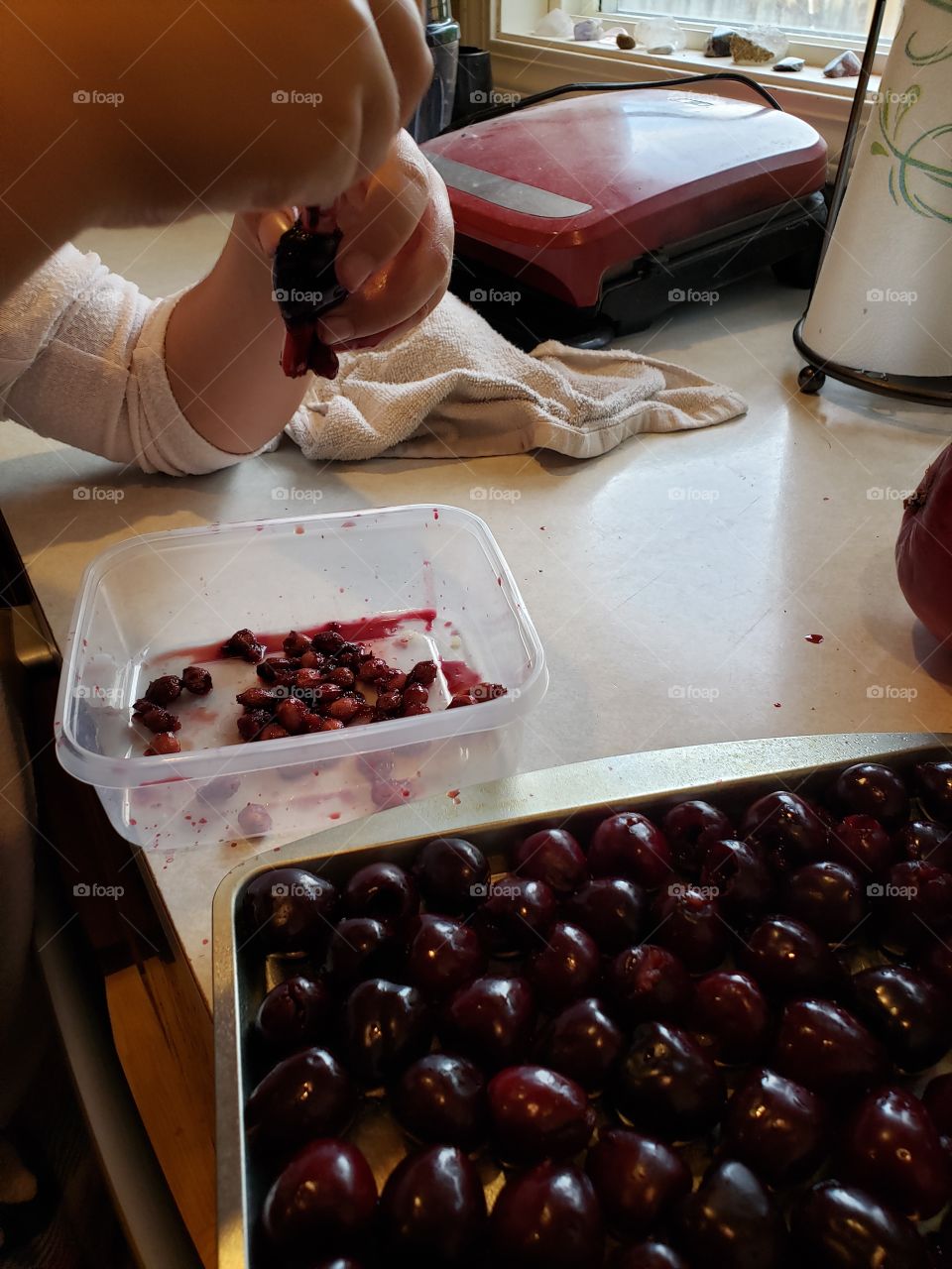 cherry pitting with a straw