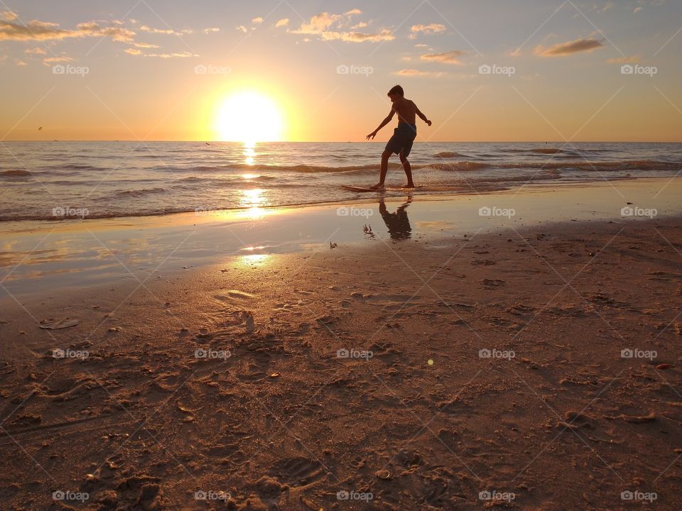 Boogie  board on the Beach
exciting Sunset experience