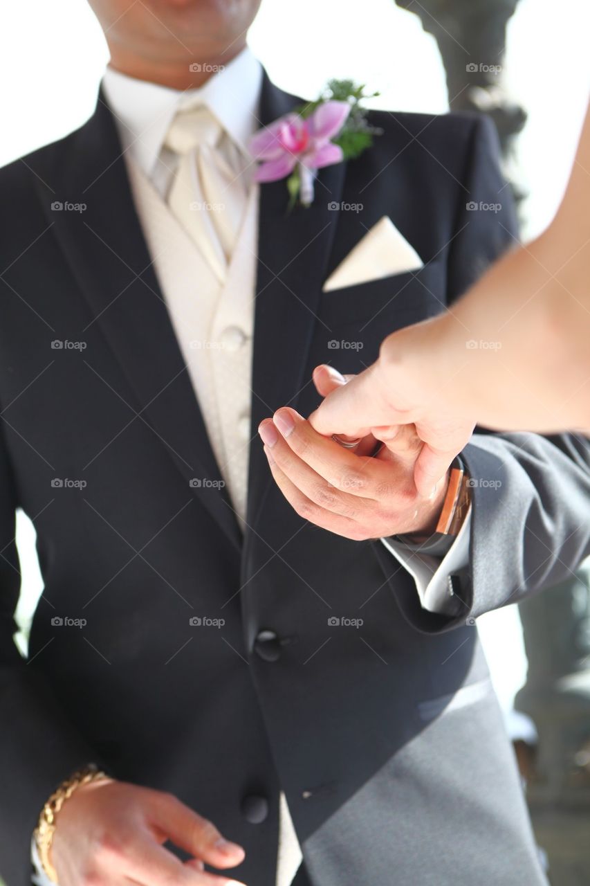 Groom takes his bride by the hand