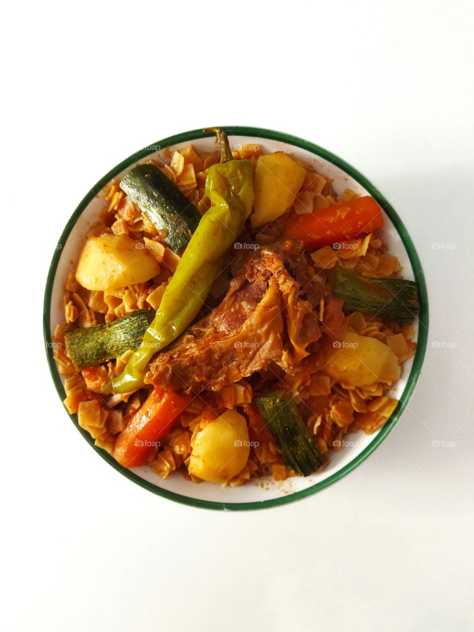 Thrida Algerian traditional recipe made with meat and vegetables, also known as Chakhchoukha (trida).