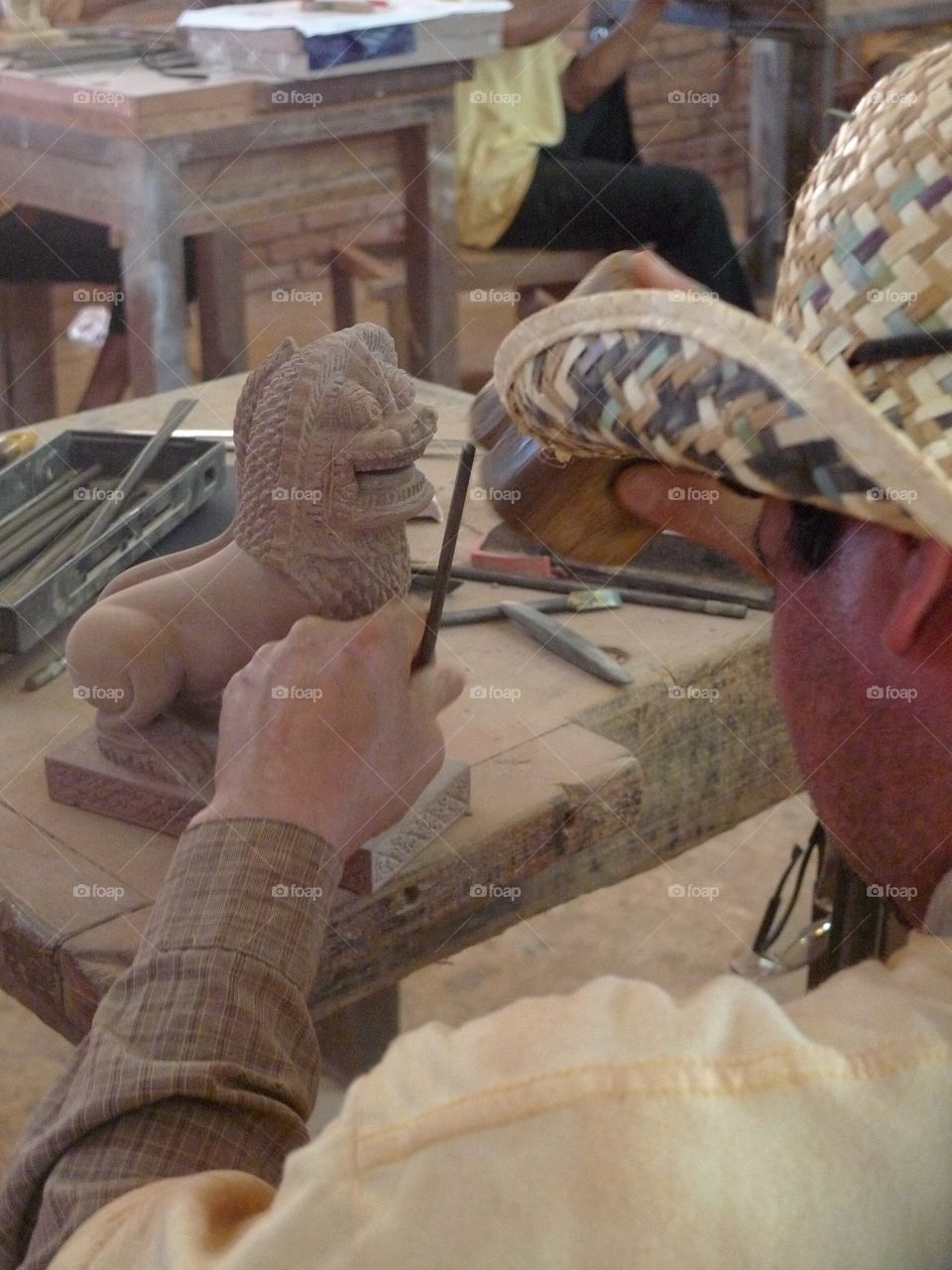 Wooden sculpture of a lion in Cambodia