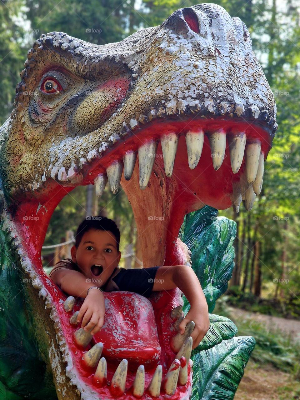 in the mouth of the dinosaur