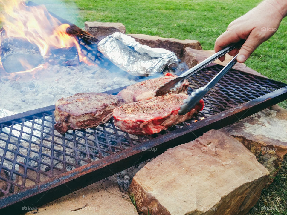 A person preparing a meat