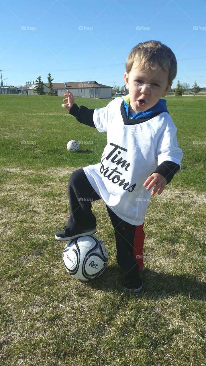 toddler playing soccer