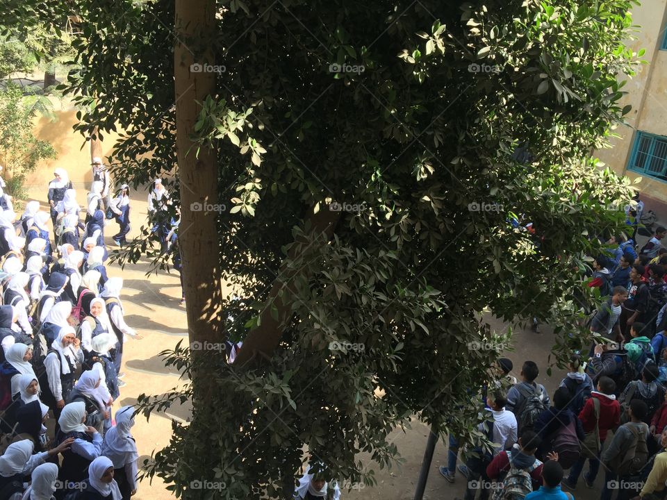 Students stand in the playground at the first day of school